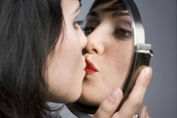 woman kissing self